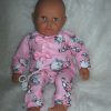 P13a Grote Babypop soft body getint  60 cm in roze kleding en speen - Afbeelding 11