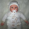 P12 Grote Babypop soft body blank 60 cm met velours kleding en speen